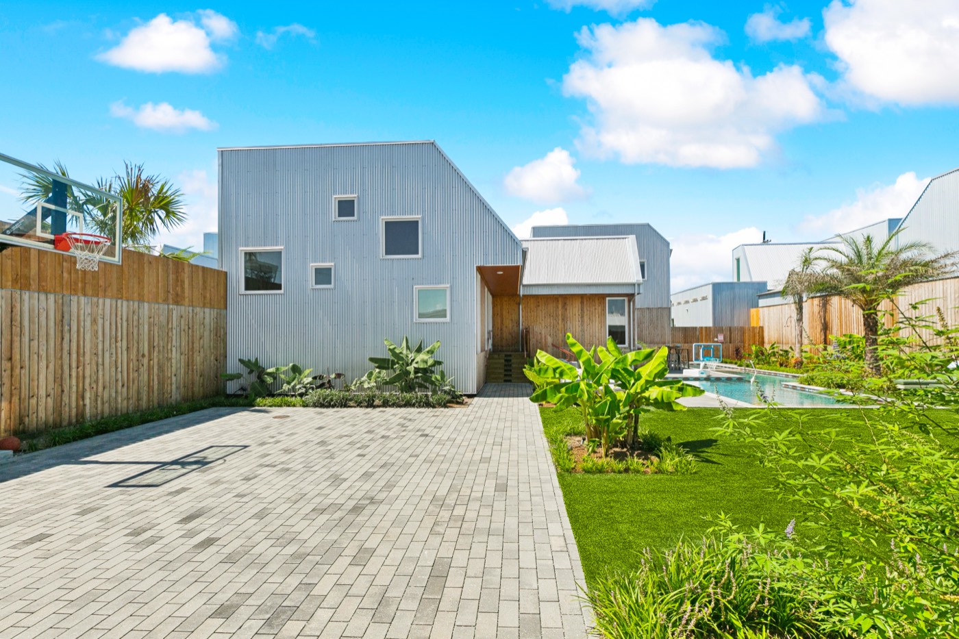 Private basketball court and villa exterior at Castleday Retreats in the Bywater